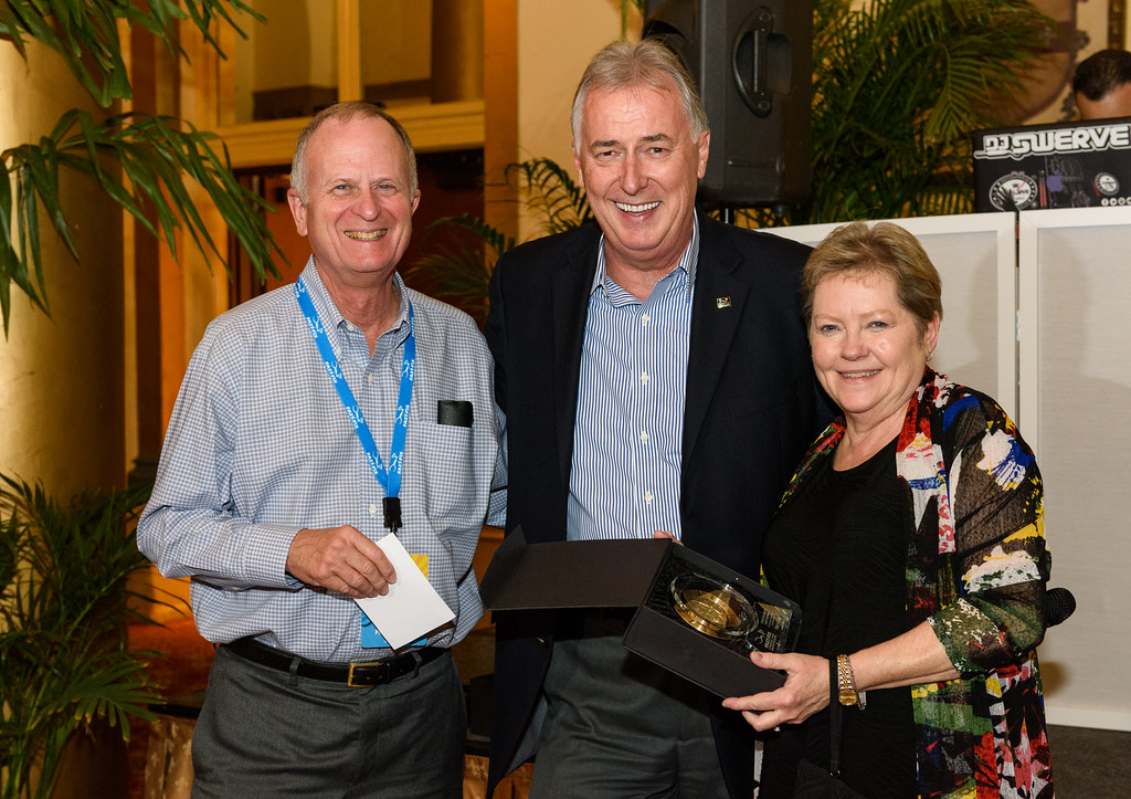 Picture of 3 smiling men receiving an award