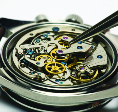 Open watch showing interior gears