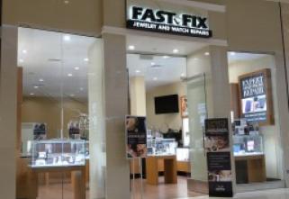 Store front of a Fast-Fix location that shows the front store window display Thumbnail