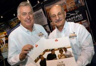 Two smiling men holding Fast-Fix brochures Thumbnail